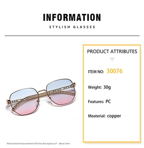 Close-up of golden copper frame with chain link temples and blue-pink gradient lenses