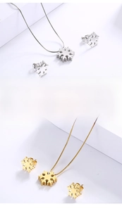 Detail of snowflake jewelry sets with necklaces and earrings in gold and silver finish