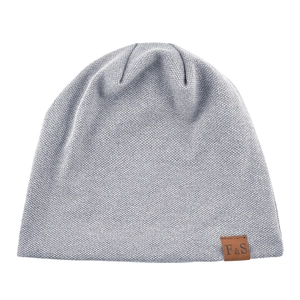 Detailed close-up of light gray knit beanie with a brown F&S leather brand label