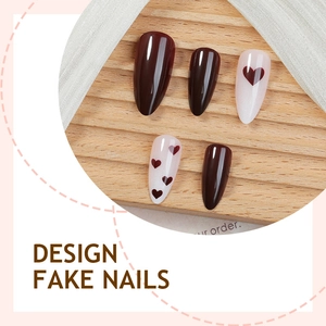 Almond-shaped brown and white heart press-on nails with high-gloss finish and gradient style