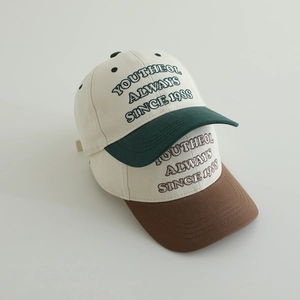 Embroidered letters spring kids baseball caps in off-white green and brown color blocking