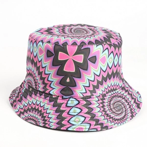 Detailed view of tie-dye bucket hat with pink and blue psychedelic spiral patterns