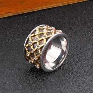 Close-up of hip hop cuban chain ring with gold and silver dual-tone finish and rhinestones