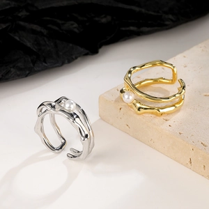 Vintage irregular gold and silver pearl rings set with adjustable metal bands