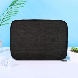 Front view of black rectangular fabric watch strap storage bag with zipper on a desk