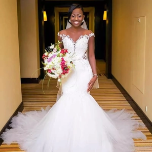 Elegant off-shoulder fisheye wedding dress with lace embroidery and voluminous tulle train