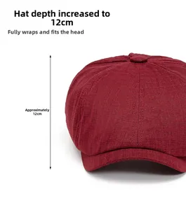 Detail view of burgundy newsboy cap with 12cm depth and fine textured fabric