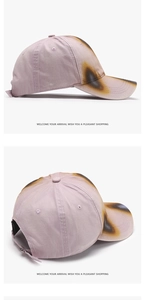Detail of washed cotton baseball cap with distressed smoke effect and vintage burnt edges