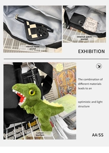 Detail of messenger bag interior showing zip pocket and green dinosaur plush charm