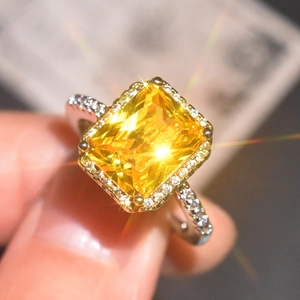 Luxury princess cut yellow diamond halo engagement ring with silver finish