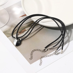 Detail of magnetic heart pendants for couples on braided cords with S925 sterling silver clasp