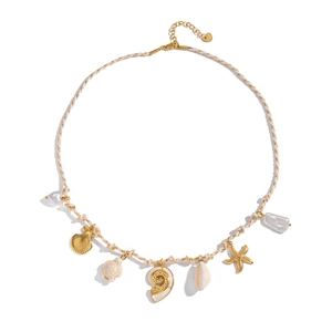 Detail of woven rope necklace with golden starfish, seashell, and baroque pearl charms
