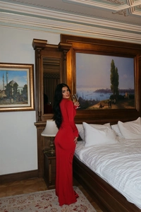 Detail of elegant red long sleeve bodycon dress with cut-out waist and flower design
