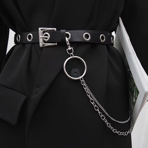 Punk style wide black eyelet belt with silver metal chains and ring on suit