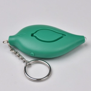 Close-up of leaf-shaped green personal safety alarm keychain with a metal ring