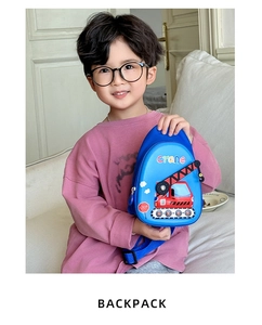 Close-up of blue kids chest bag featuring a cartoon crane print and adjustable strap