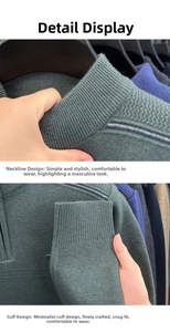 Detail view of ribbed collar and cuffs on a dark green men's knit sweater