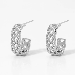 Detail of silver C-shaped mesh earrings featuring two rows of inlaid sparkling crystals