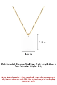 Detailed view of titanium steel gold circle pendant with crystal and black enamel