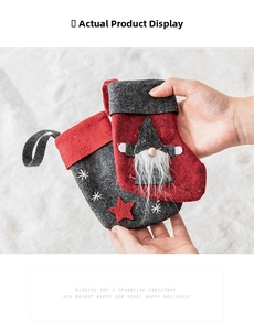 Detail of wool felt Christmas stockings featuring Nordic gnomes and snowflake embroidery