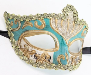 Detail of Venetian mask with musical notes pattern, gold glitter and blue accents