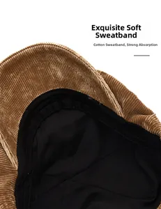 Detailed close-up of internal cotton sweatband on the brown corduroy newsboy cap