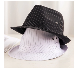 Detail showing stack of black and white pinstripe fedora hats with metal eyelets