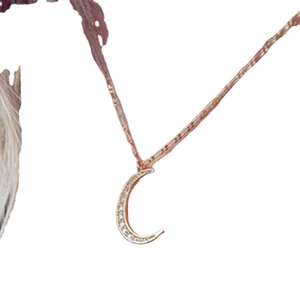 Elegant rose gold crescent moon necklace decorated with sparkling clear rhinestones