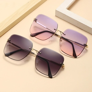 Macro detail of gradient lenses and sleek metal temples on oversized sunglasses