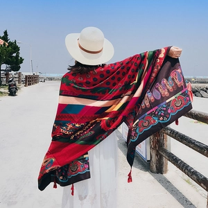 Ethnic paisley print beach shawl in vibrant red with boho patterns and fringe tassels