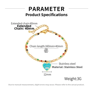 Detail view of 12mm evil eye heart pendant on double-layer gold stainless steel chain