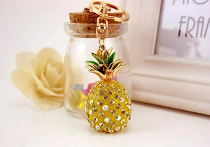 Detailed view of the rhinestone-studded pineapple keychain with gold-tone alloy hooks