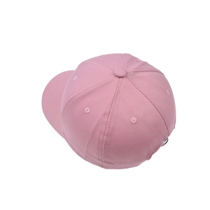 Top view of pink cotton baseball cap featuring curved brim and embroidered eyelets