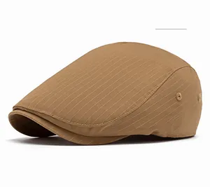 Detail view of khaki striped newsboy cap with metal eyelets and premium fabric texture