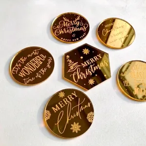 Golden acrylic Merry Christmas cake toppers with festive laser-engraved mirror patterns