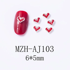 Macro view of red heart nail art charms with silver base and 6x5mm size details