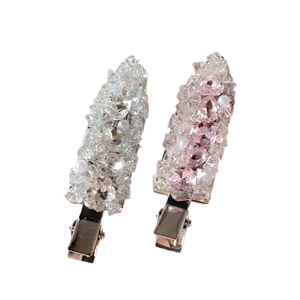 Elegant rhinestone hair clips in white and pink crystal on polished alloy base