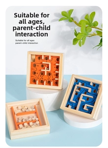 Close-up of wooden balance maze puzzle with numbered paths and colorful metal balls