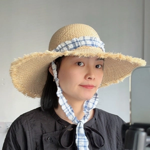 Lafite straw sun hat with wide frayed brim and blue gingham ribbon ties for women