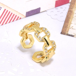 Golden chain link open ring with zircon stones shown on a minimalist white background
