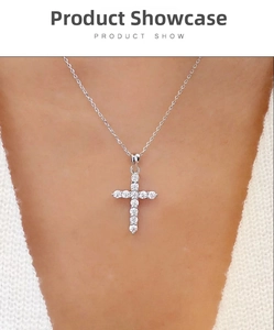 Close-up of a silver cross pendant necklace with sparkling pavé cubic zirconia