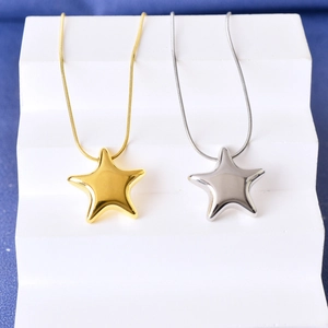 Polished star pendant necklaces in gold and silver steel on a snake chain