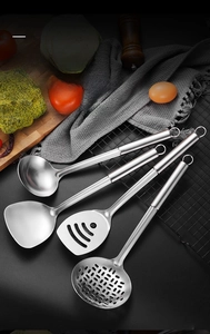 Close-up of food grade 430 stainless steel utensil set with brushed finish on dark surface