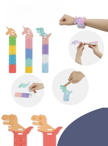 Detail showing SQUIDOPOP silicone suction toy used as a colorful stress-relief bracelet