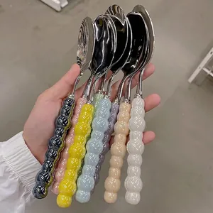Modern stainless steel spoons with creative bubble handles in six assorted colors