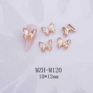 Detalle de dijes para uñas de mariposa de cristal 3D con base dorada moka, 10x12mm