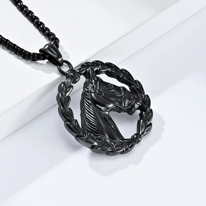 Close-up of black stainless steel pendant featuring a carved horse head in a laurel wreath