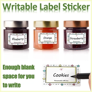 Waterproof food label stickers on fruit jars with hand-written Cookies text