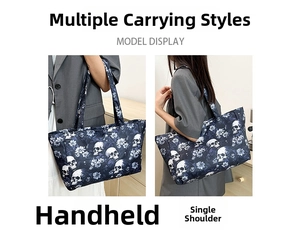 Detail of gothic tote bag with skull and floral print showing hand and shoulder carry