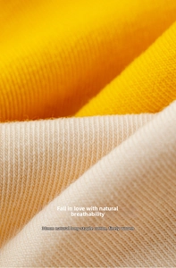 Close-up of 38mm long-staple cotton fabric with fine knit texture in yellow and cream